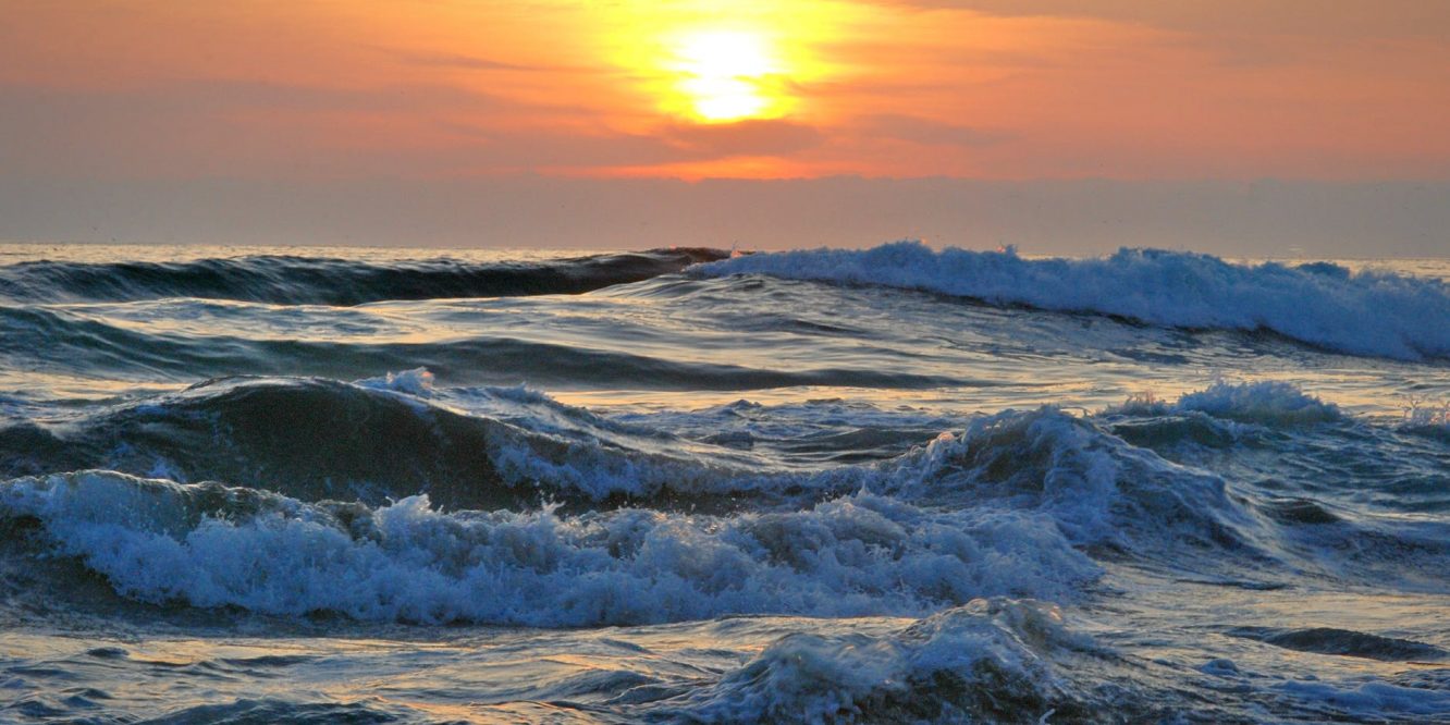 ocean water during yellow sunset